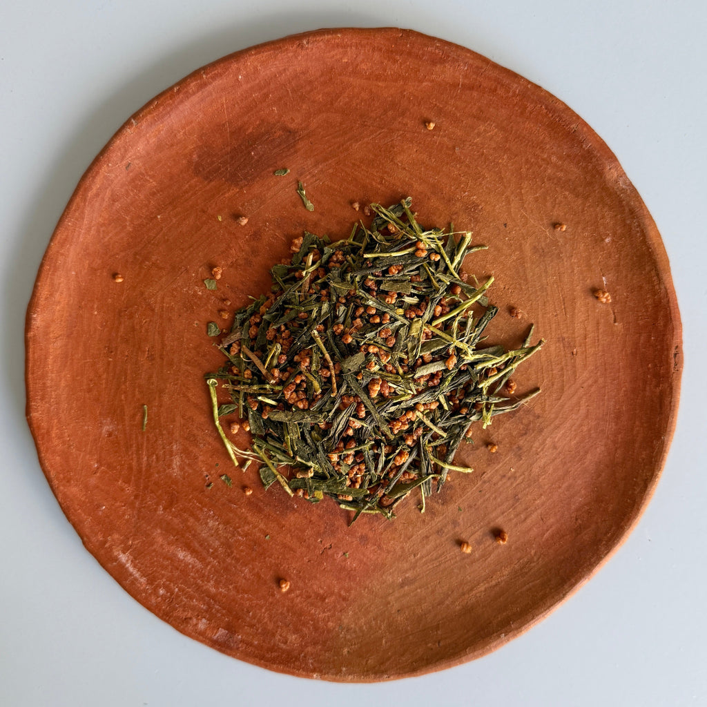 Ceramic plate with genmaicha green tea blended with roasted rice from Teanuki. 