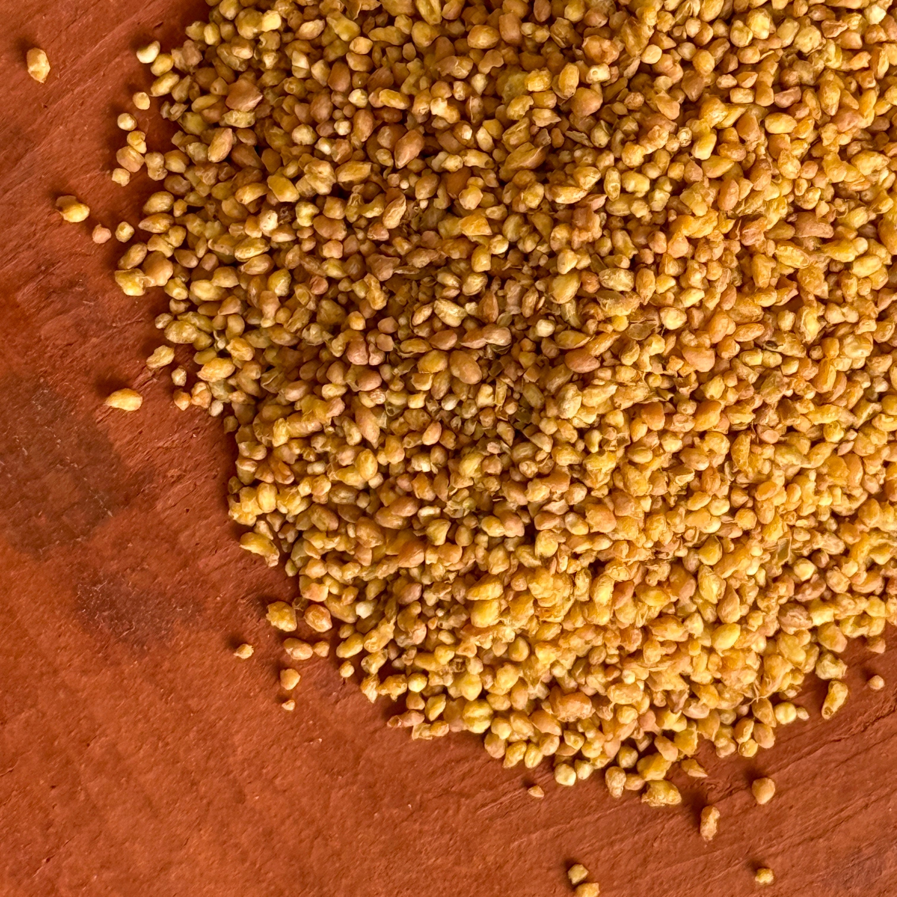 Roasted sobacha on a clay plate with warm lighting. 