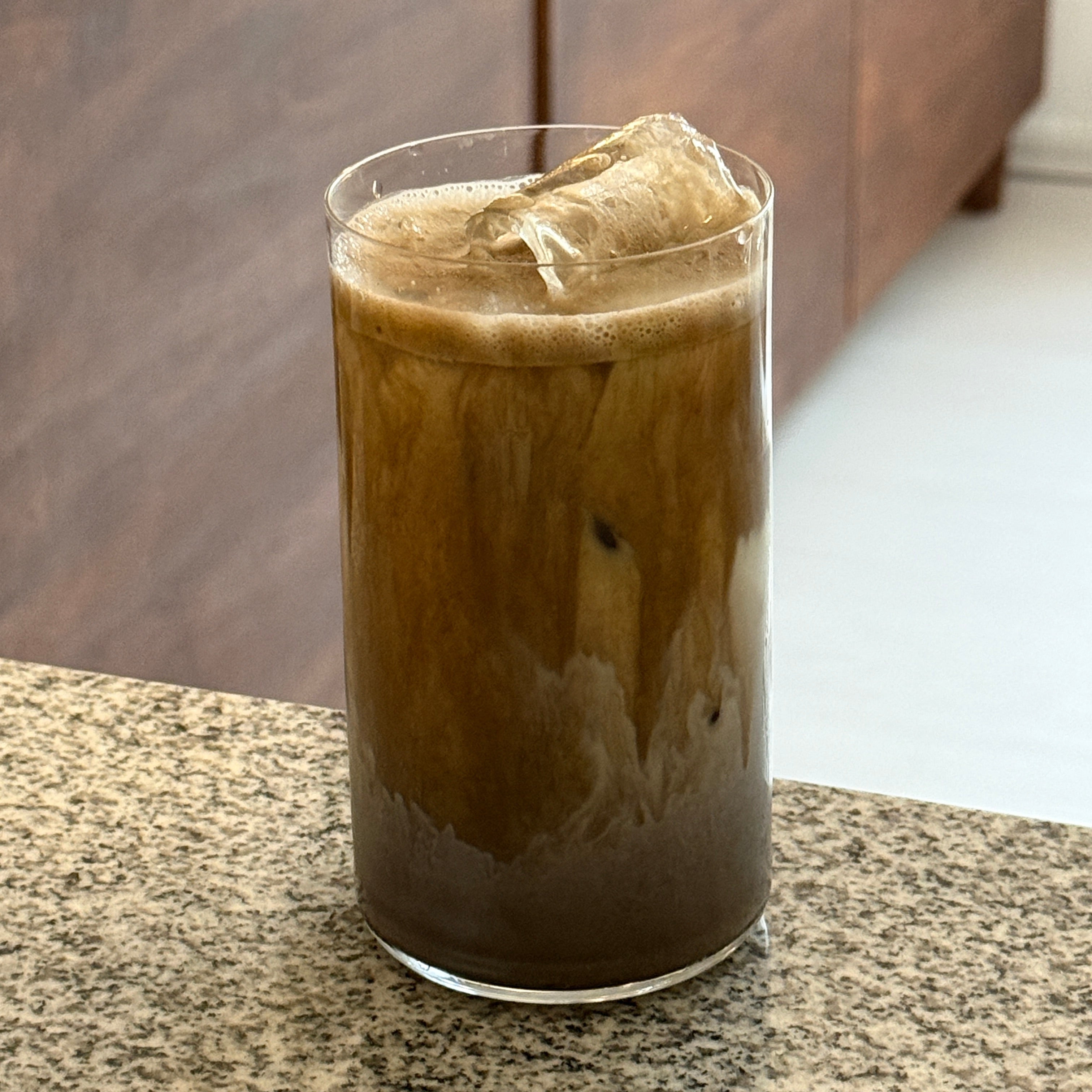 A teanuki hojicha vanilla latte in a tall glass. 